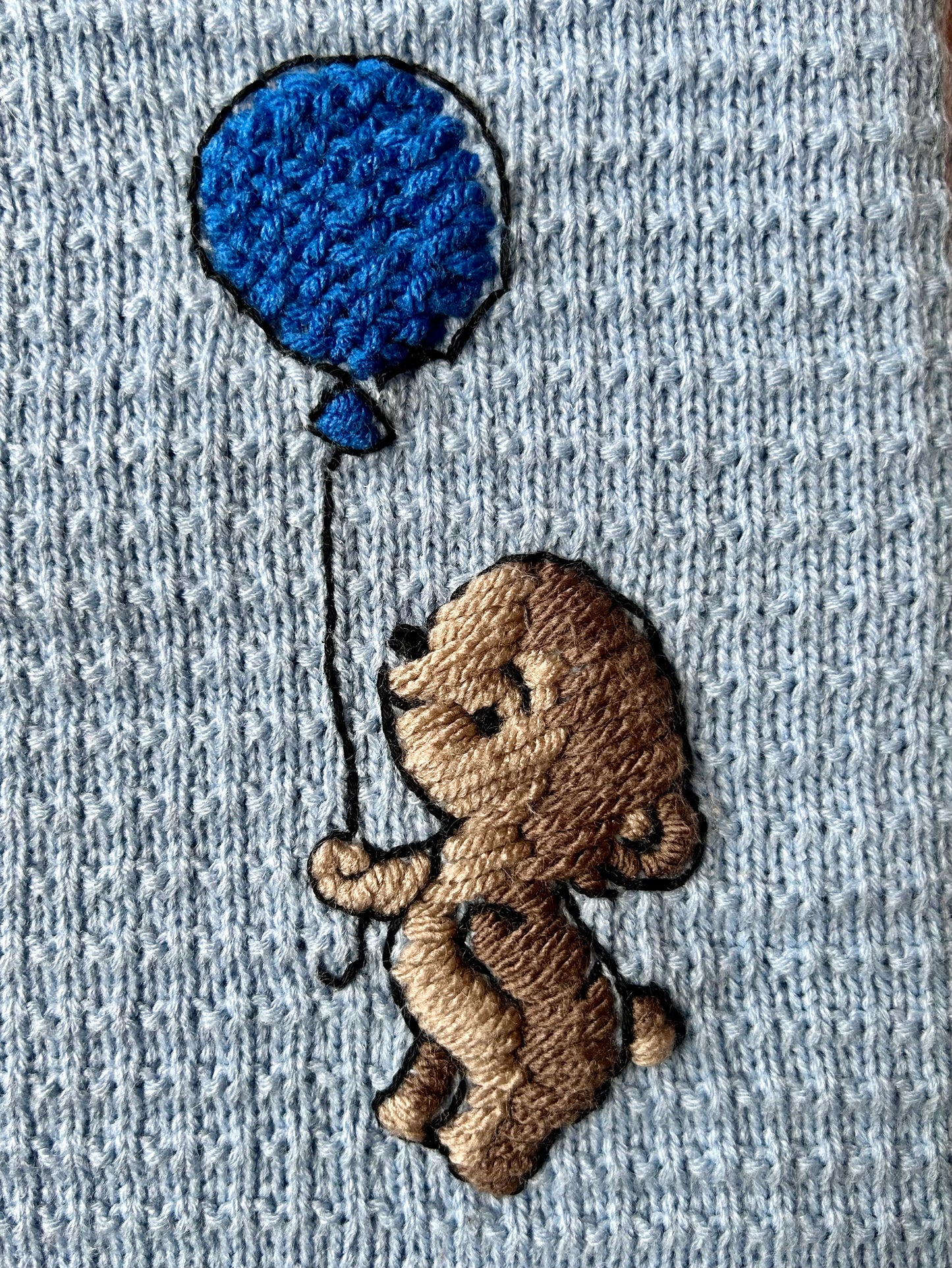 Teddy bear with balloon